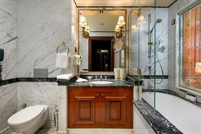 The spacious bathroom with a full bath, premium amenities, and daily housekeeping ensures consistent freshness.