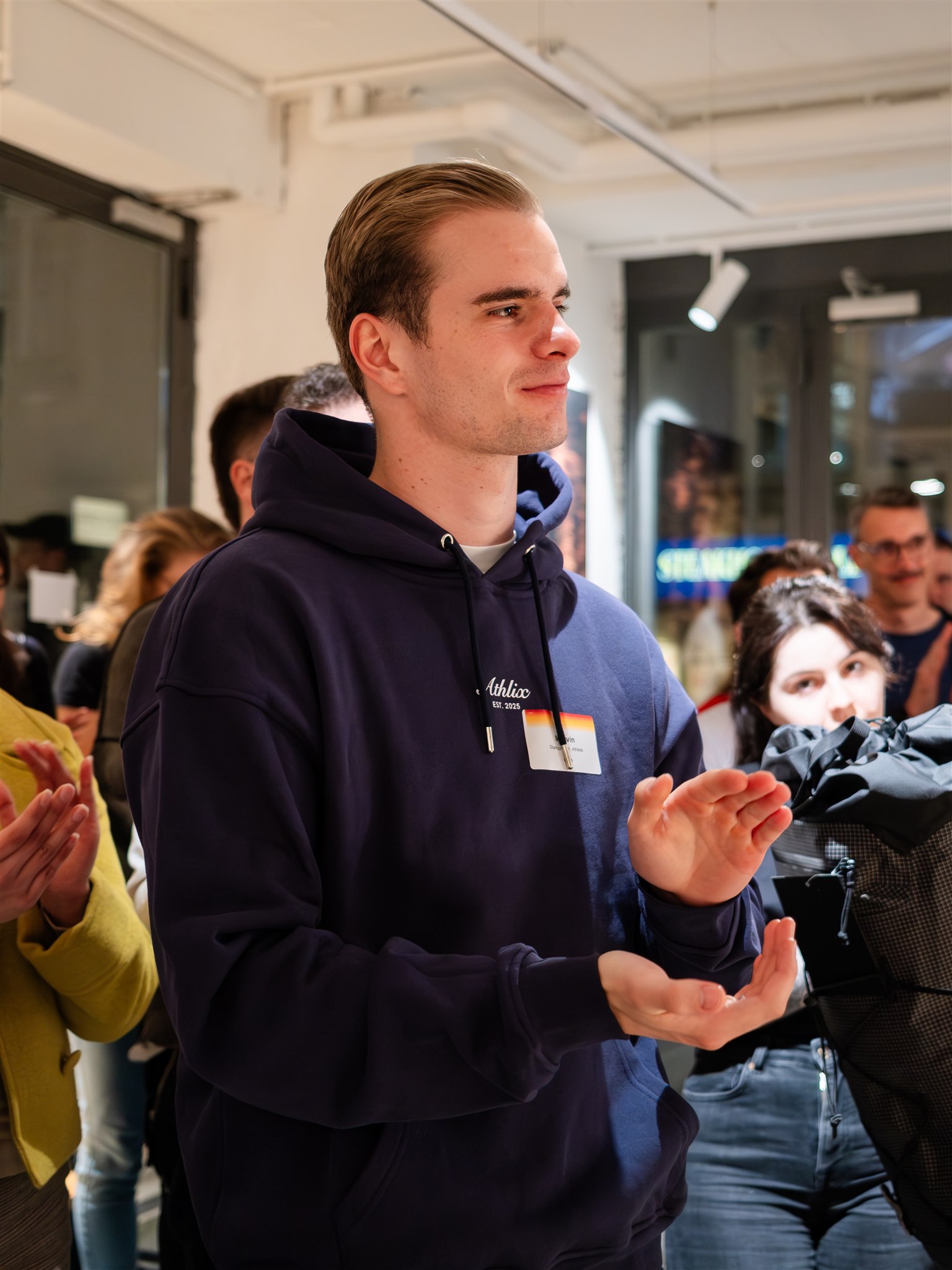 Guest applauding during presentation at Zurich event