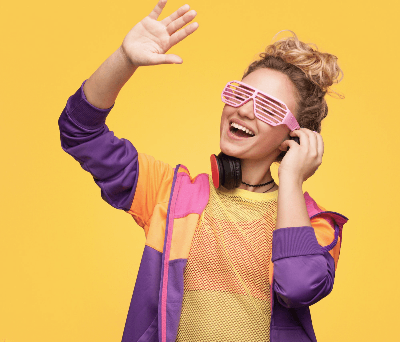 A woman wearing a purple and yellow outfit