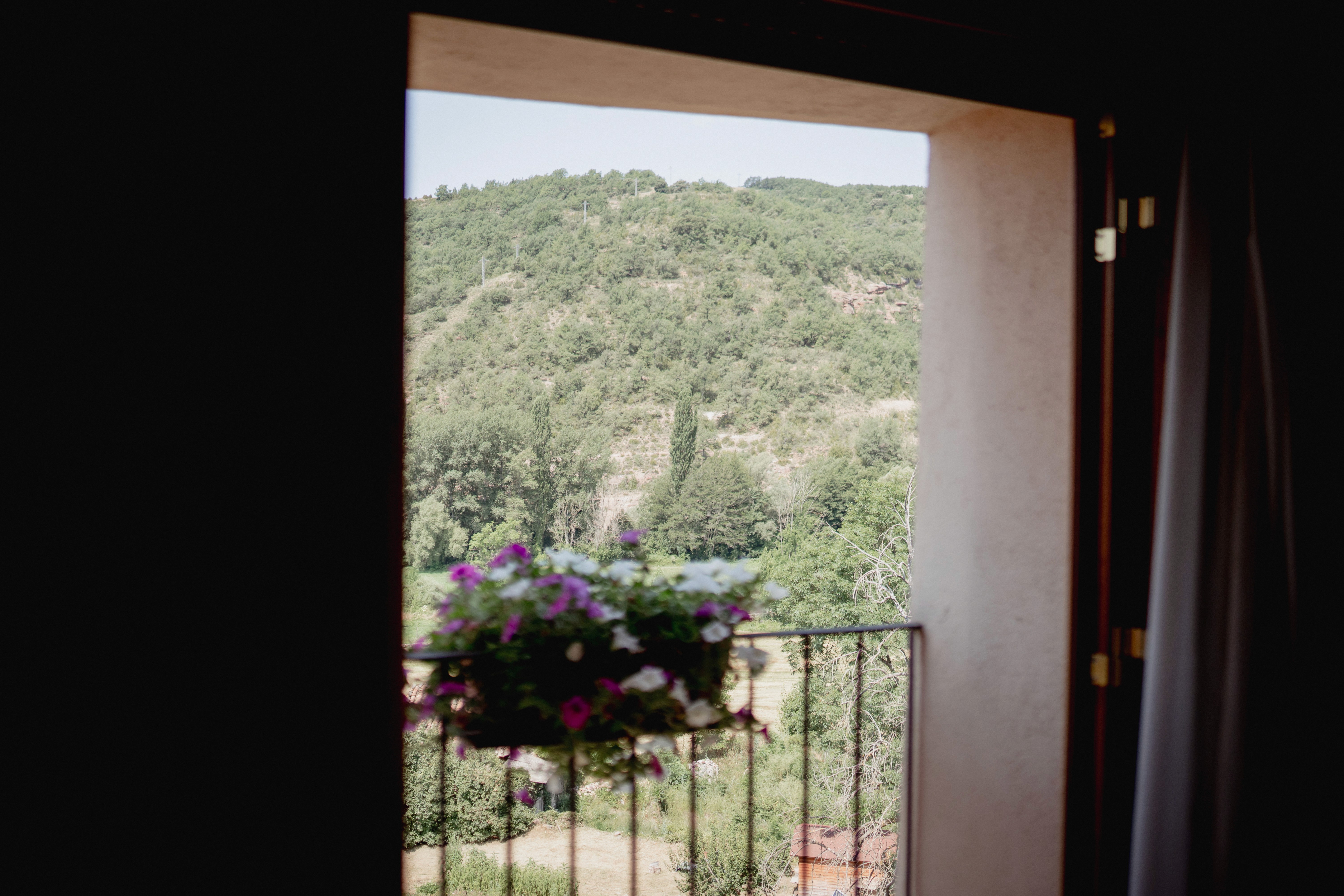 lounge room with large contemporary lamp, cozy sofa and blue toned painting of Venice