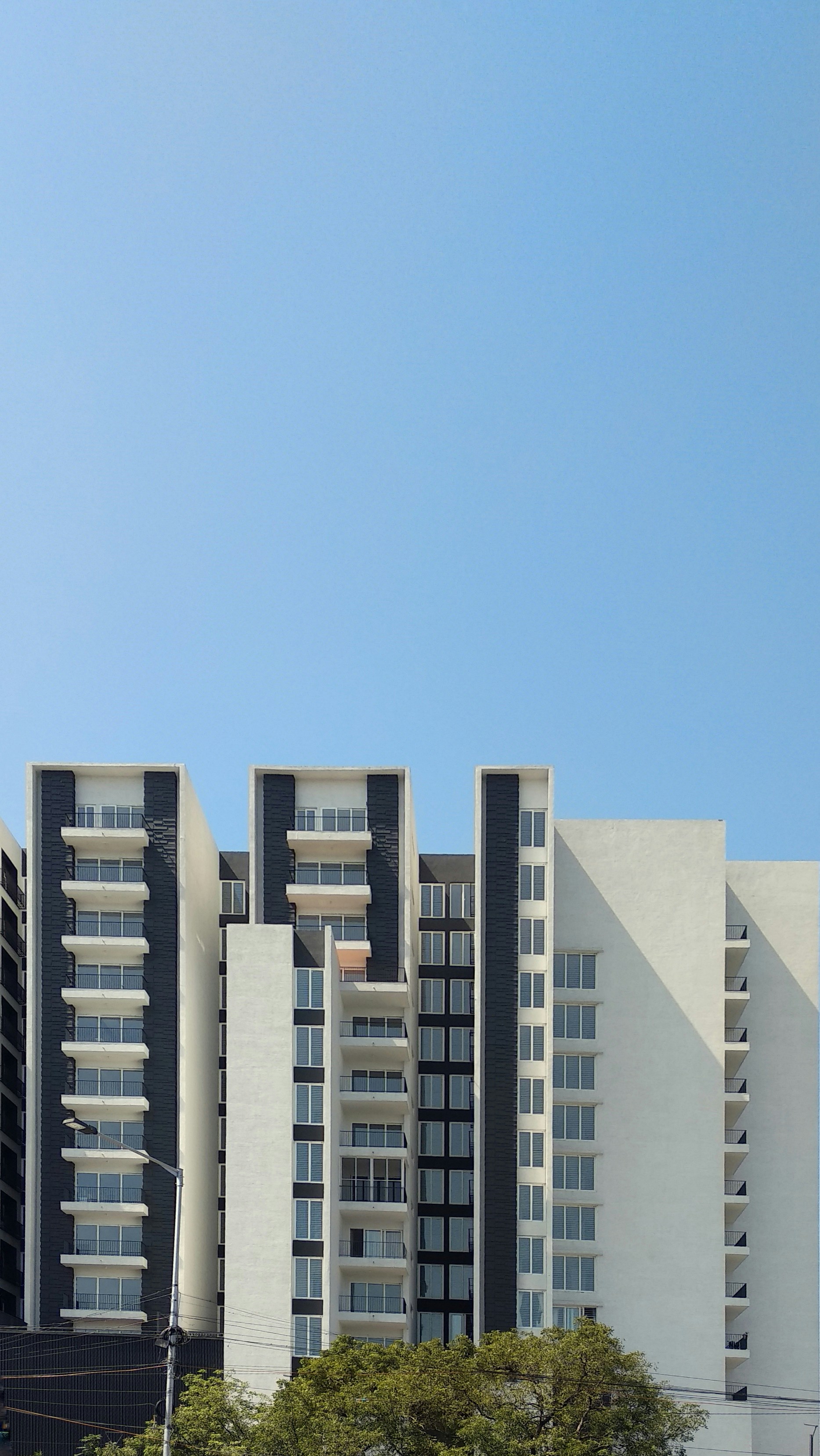 white concrete building under blue sky during daytime