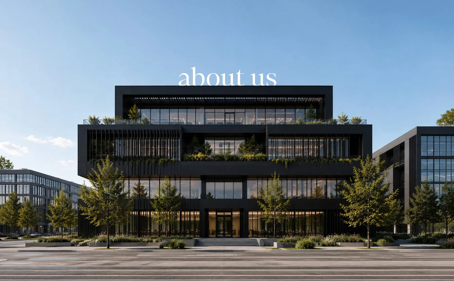 Hero image of a black building with an “about us” text
