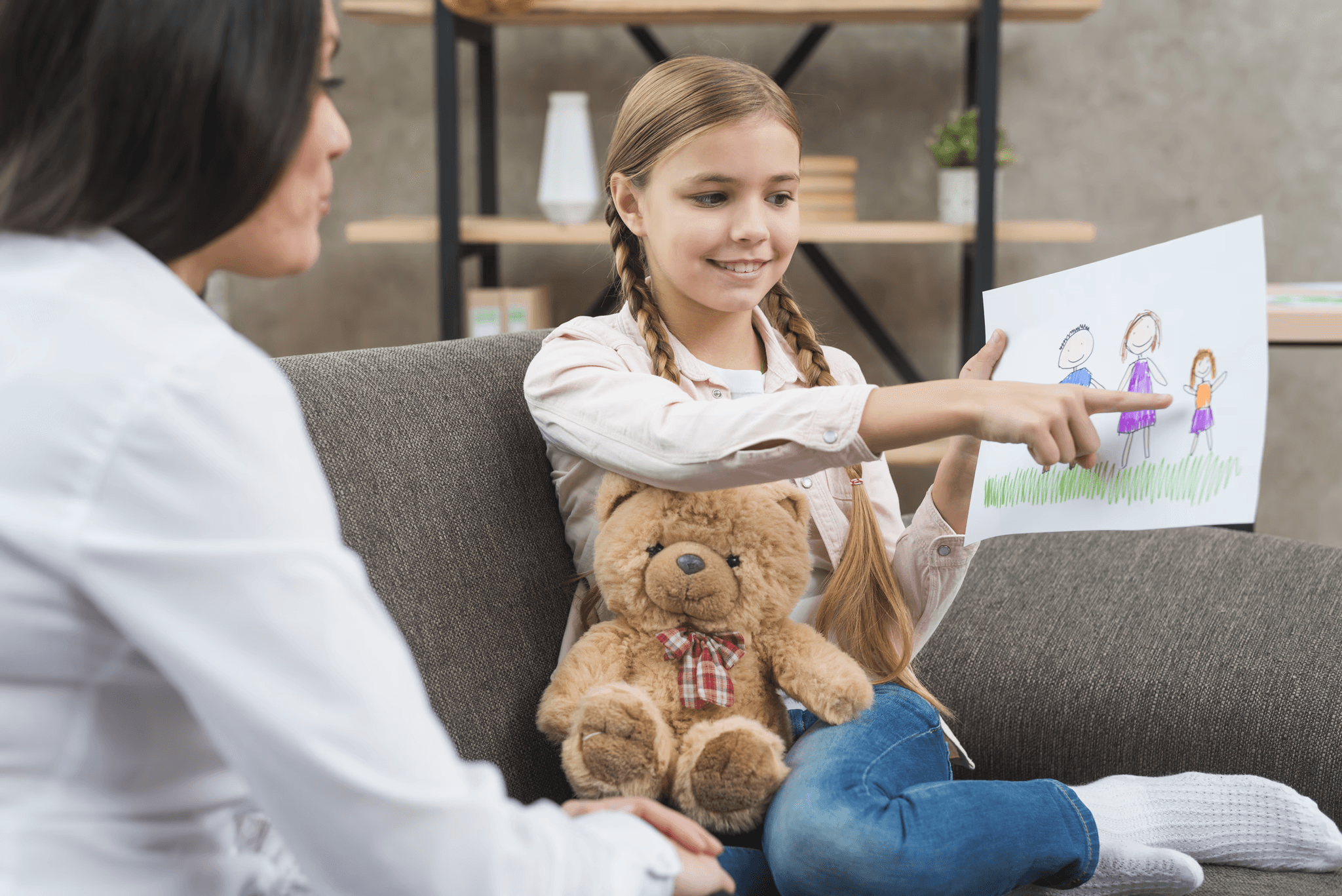 Young girl showing a drawing during a child counselling session with a psychologist from Melbourne Children's Psychology Clinic