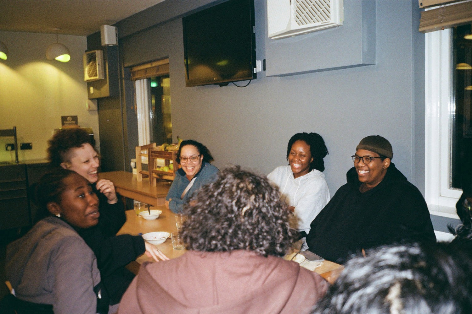 A group laughing around the breakfast table