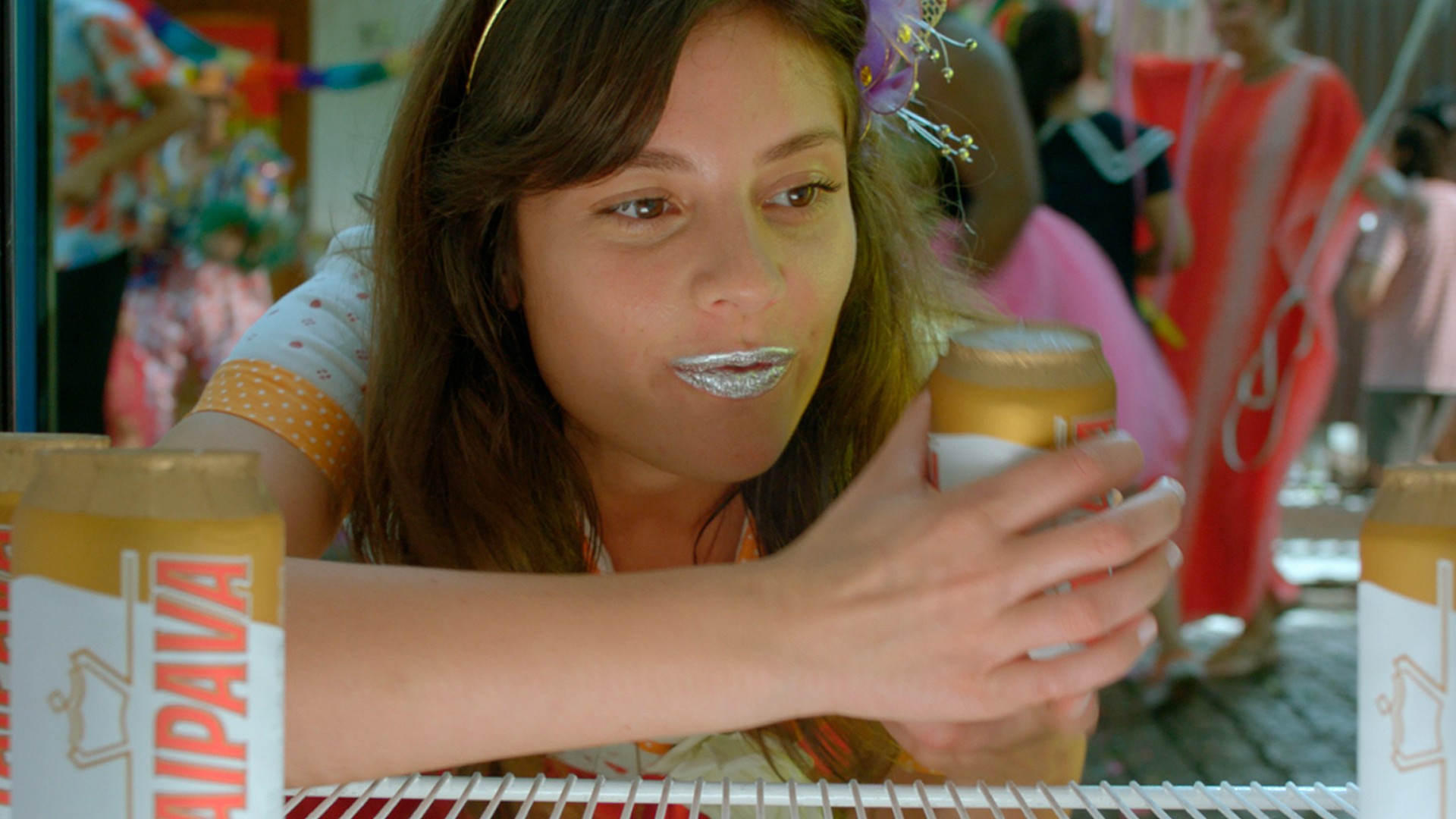 Woman looking at a beer can