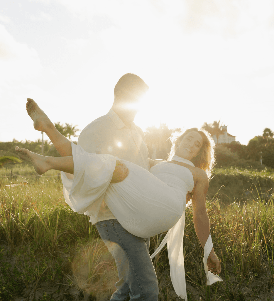     Wedding photographer in South Florida captures a couple embracing in golden light during an outdoor wedding portrait session.