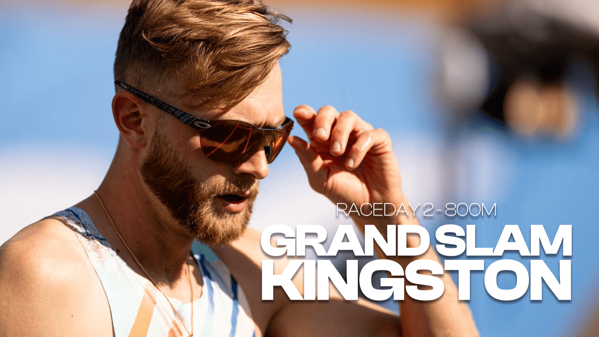 Model walking through a wheat field with a distant gaze.
