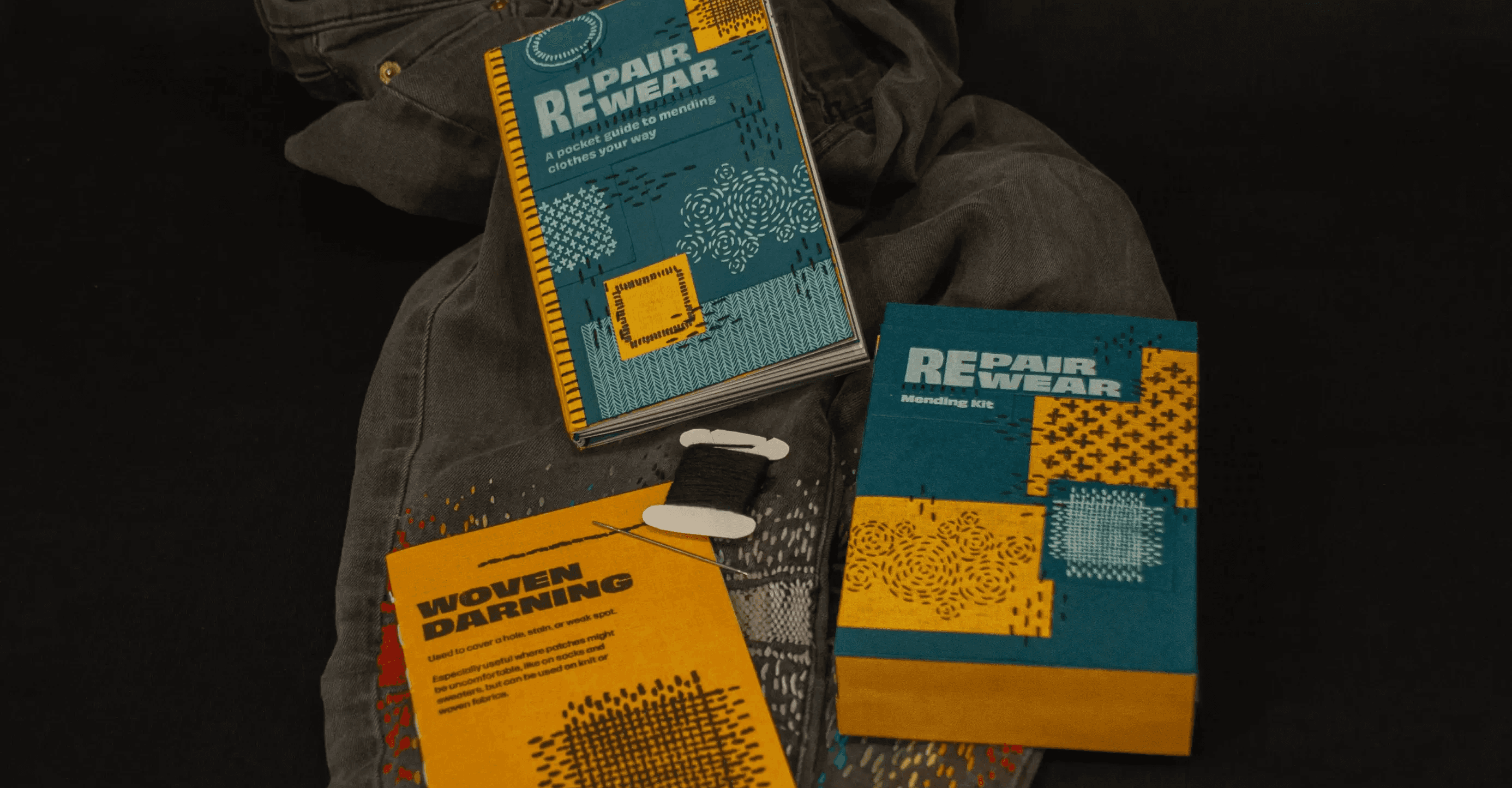 Mending guide and kit on top of mended jeans