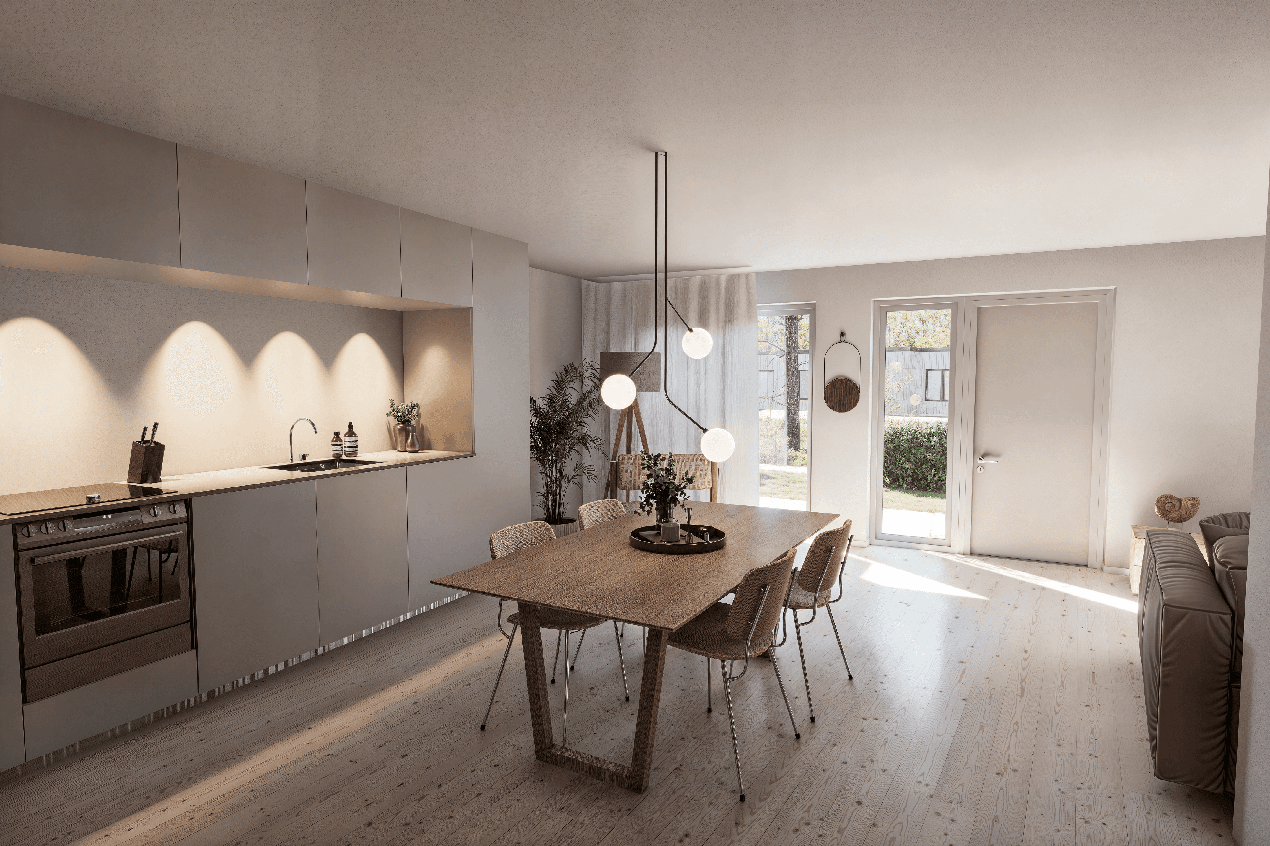 Modern glass buildings with illuminated facades and trees on a rainy day