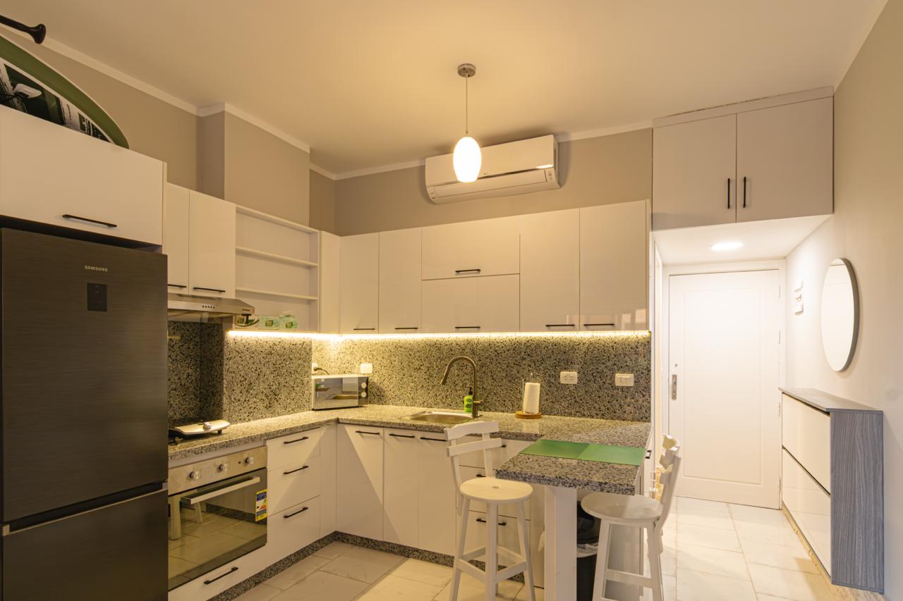 brown wooden house with green grass field