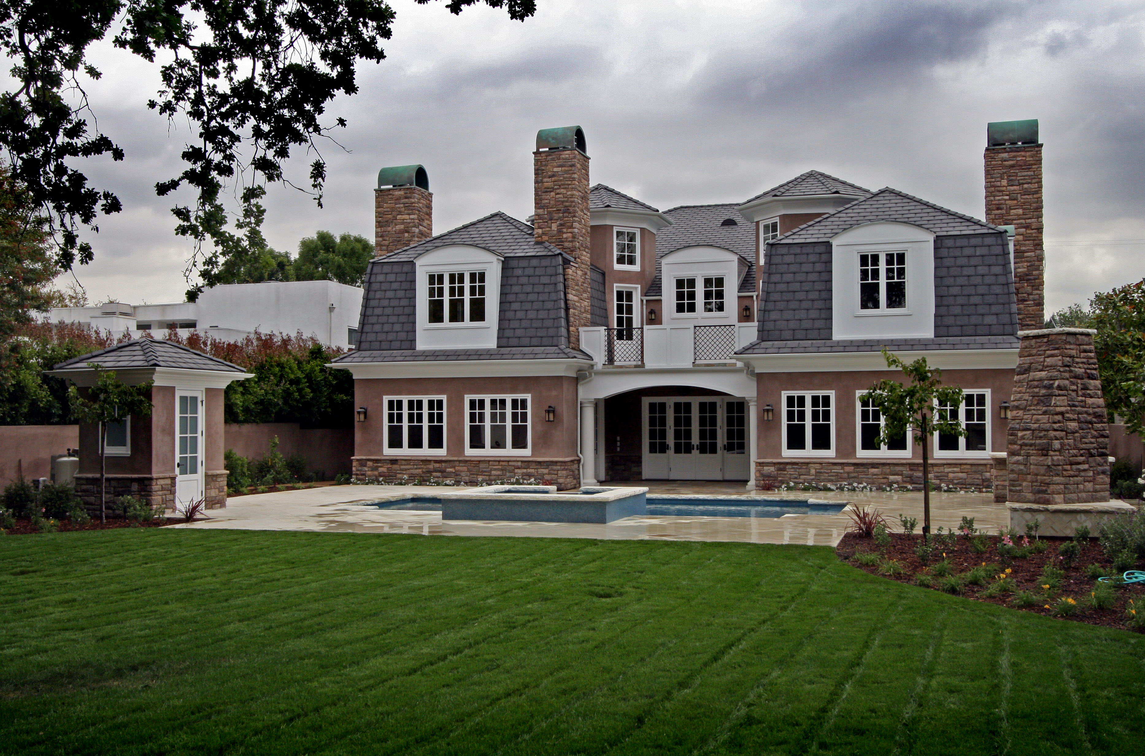 Rear exterior view of the home, showcasing the blend of materials and the inviting atmosphere.