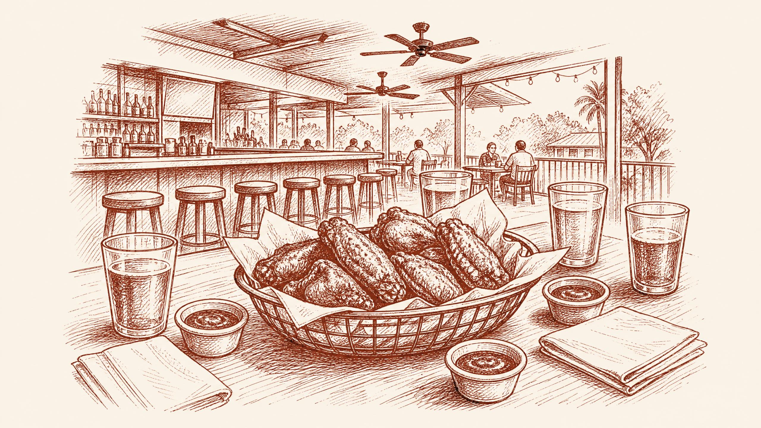 A metal basket of wings as the central game-night object, surrounded by plain glasses -- cheap eats near usf