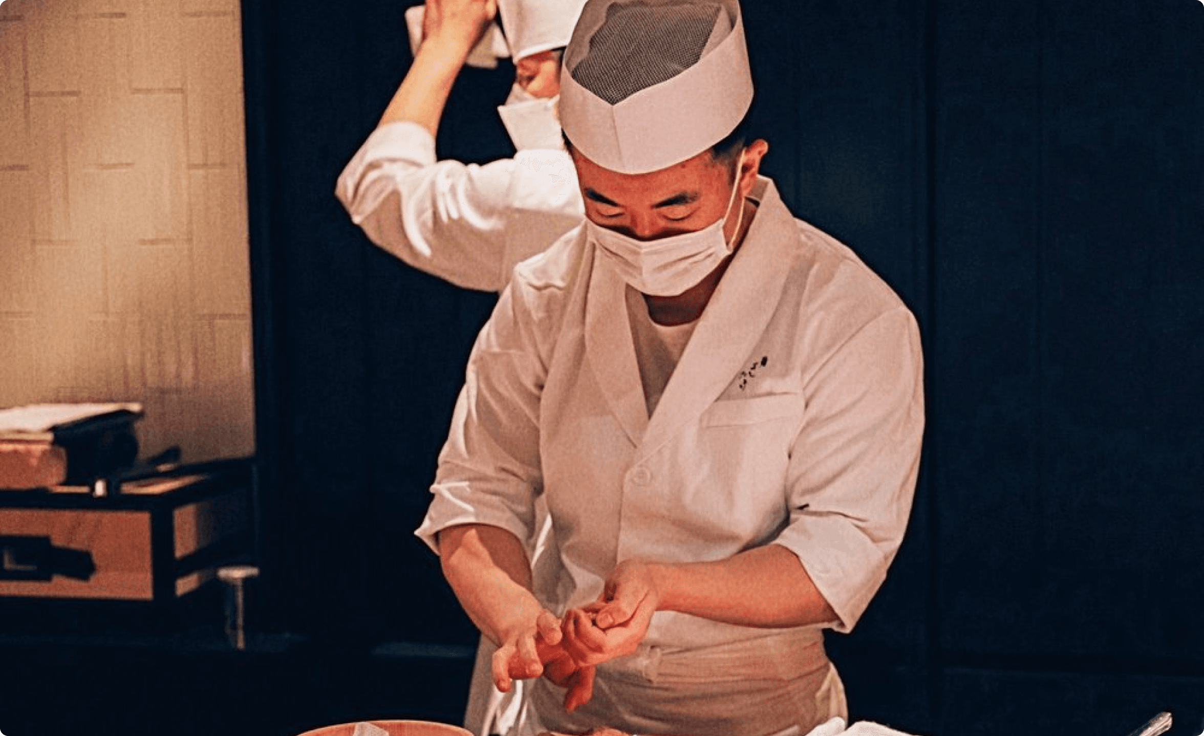 owner chef Yoji Masuda making sushi at sushi counter