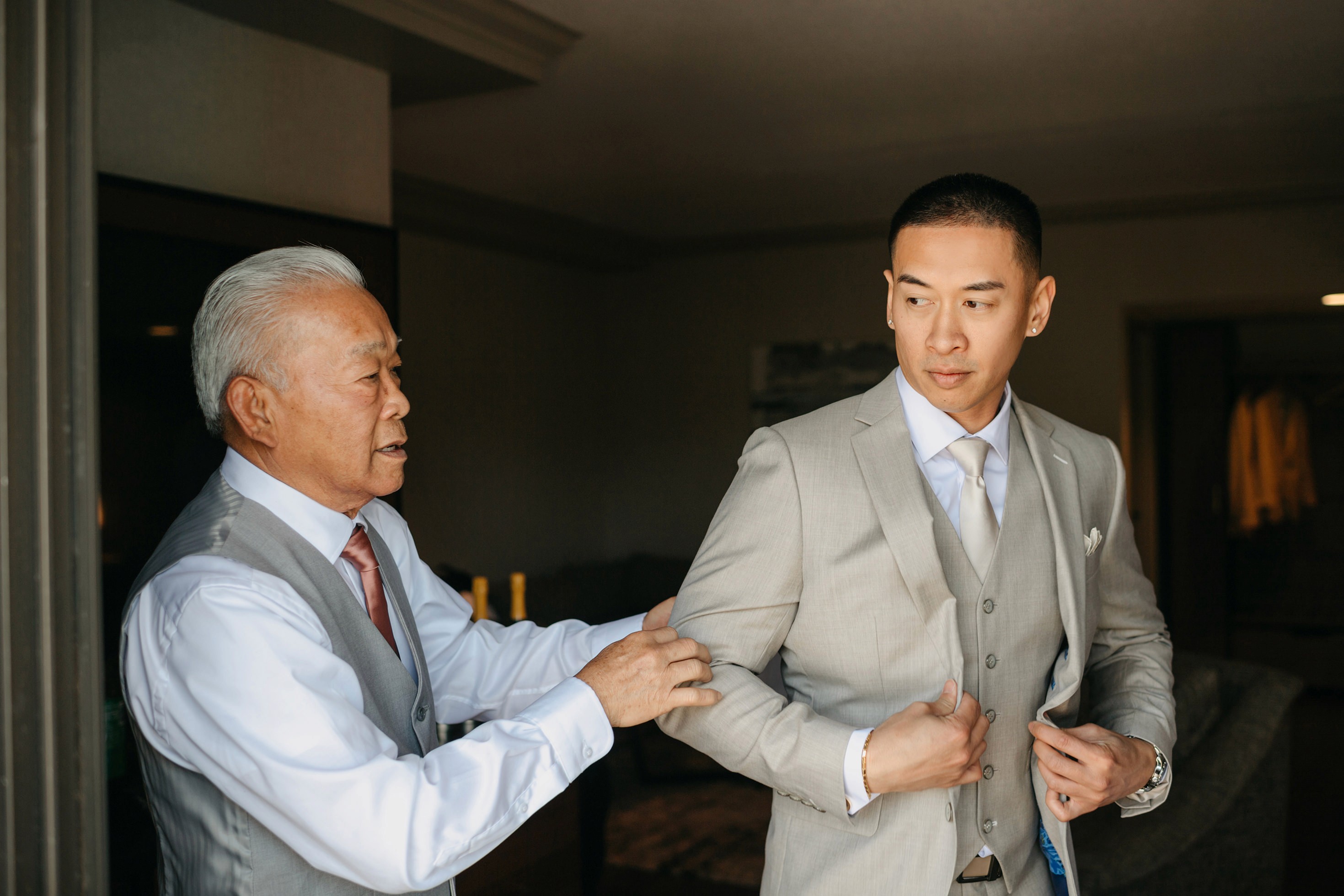 Flat lay wedding details with bouquet, rings, and sparkling bridal heels