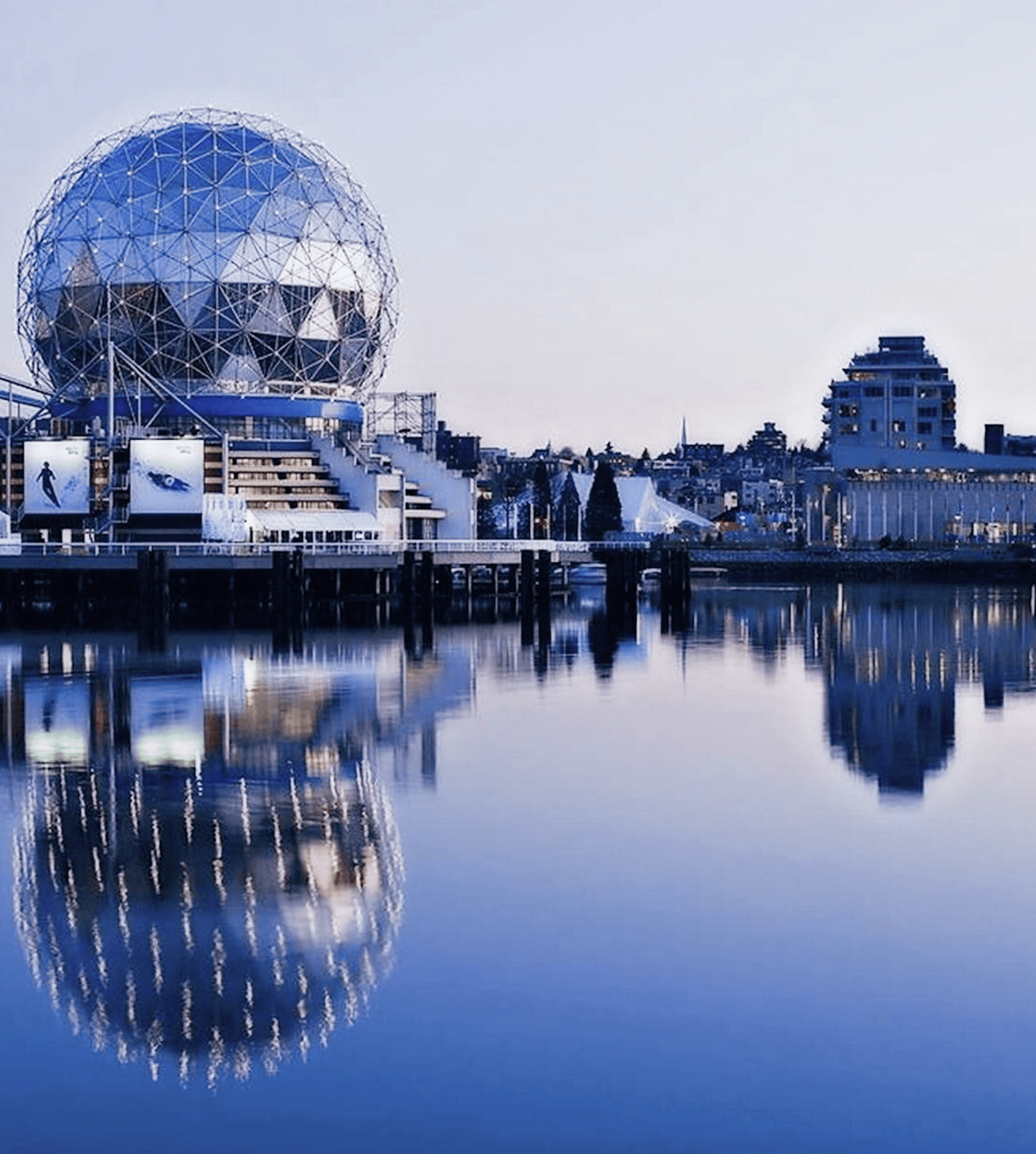 A modern office with rows of desks and computers.