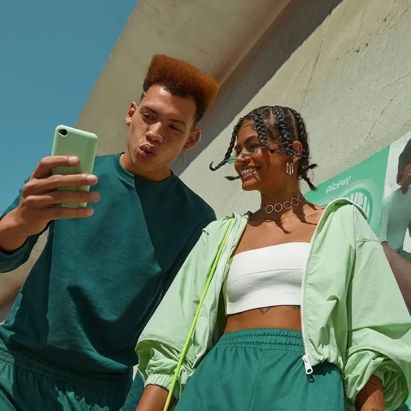 Two friends using a payment app
