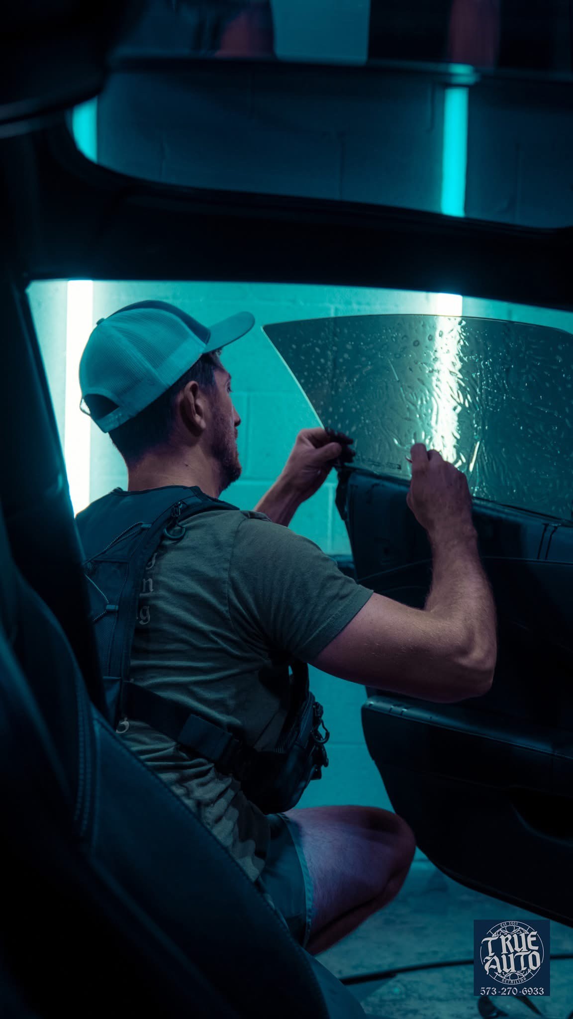 Man applying window tint