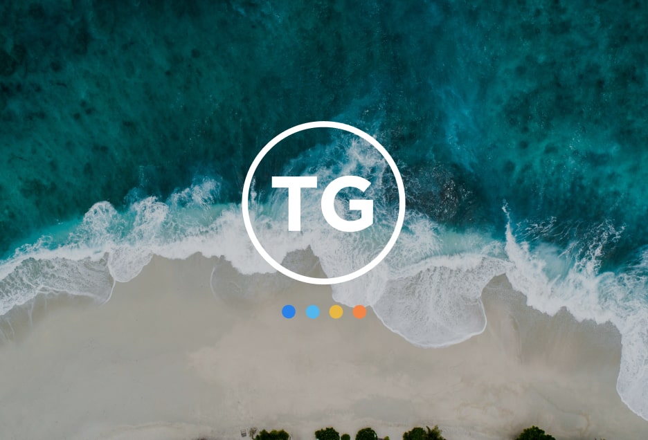 Aerial view of a beach with the Towbes Group logo overlaid.