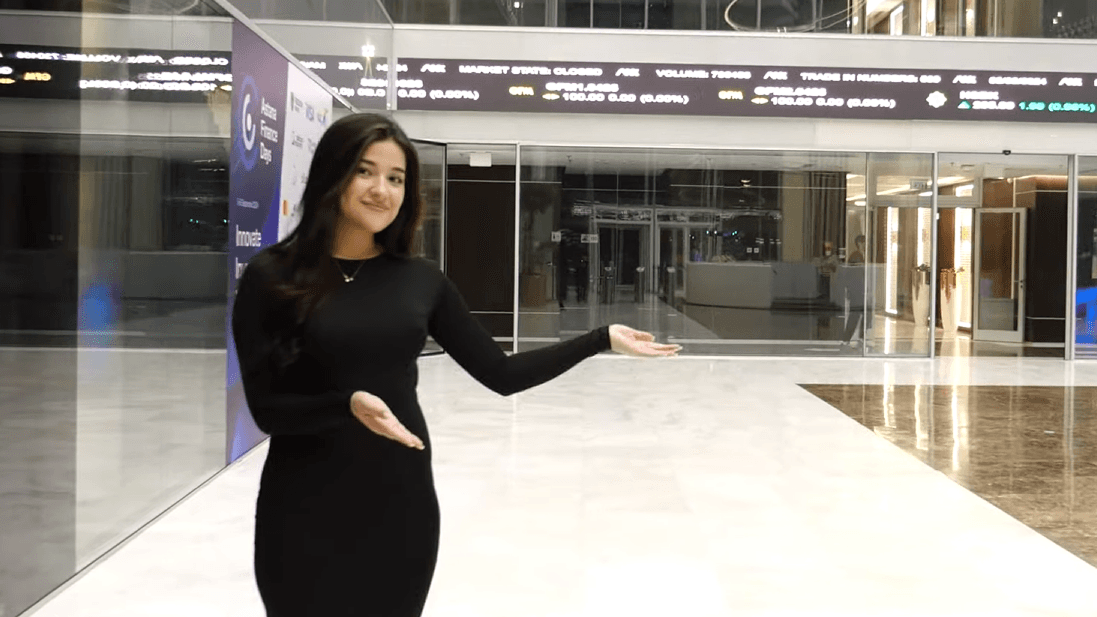 Close-up of an eye with creative makeup and white feathers.