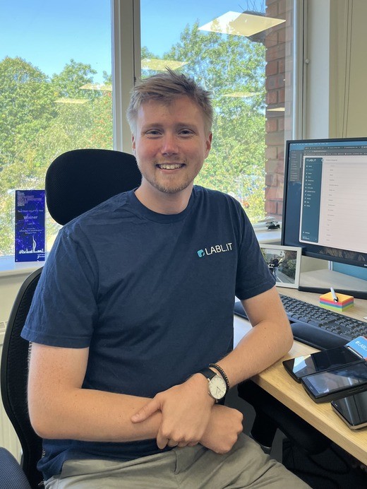 Customer Success Manager Dom at his desk