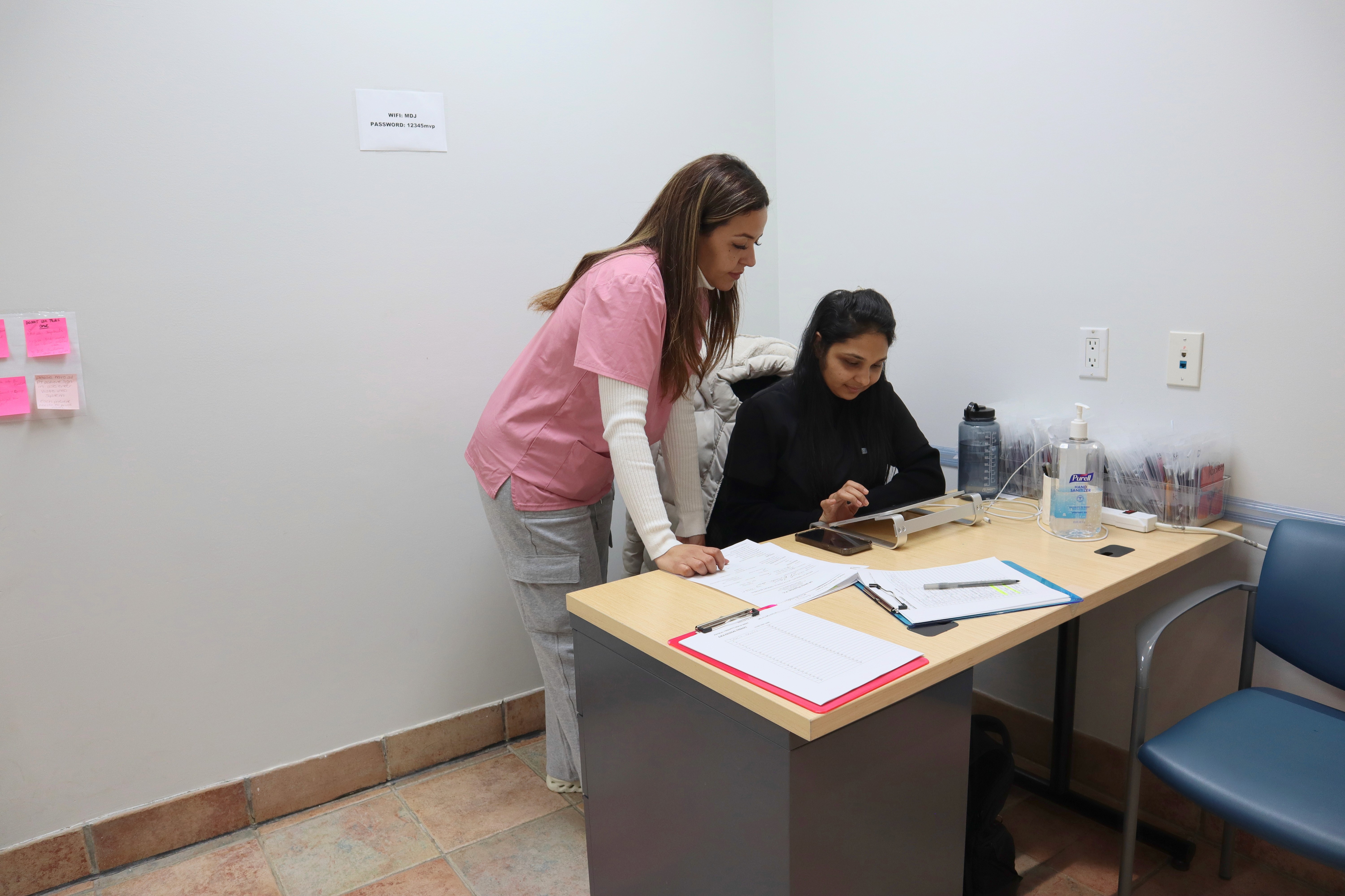 brunette-female-doctor-talking-patient-doctors