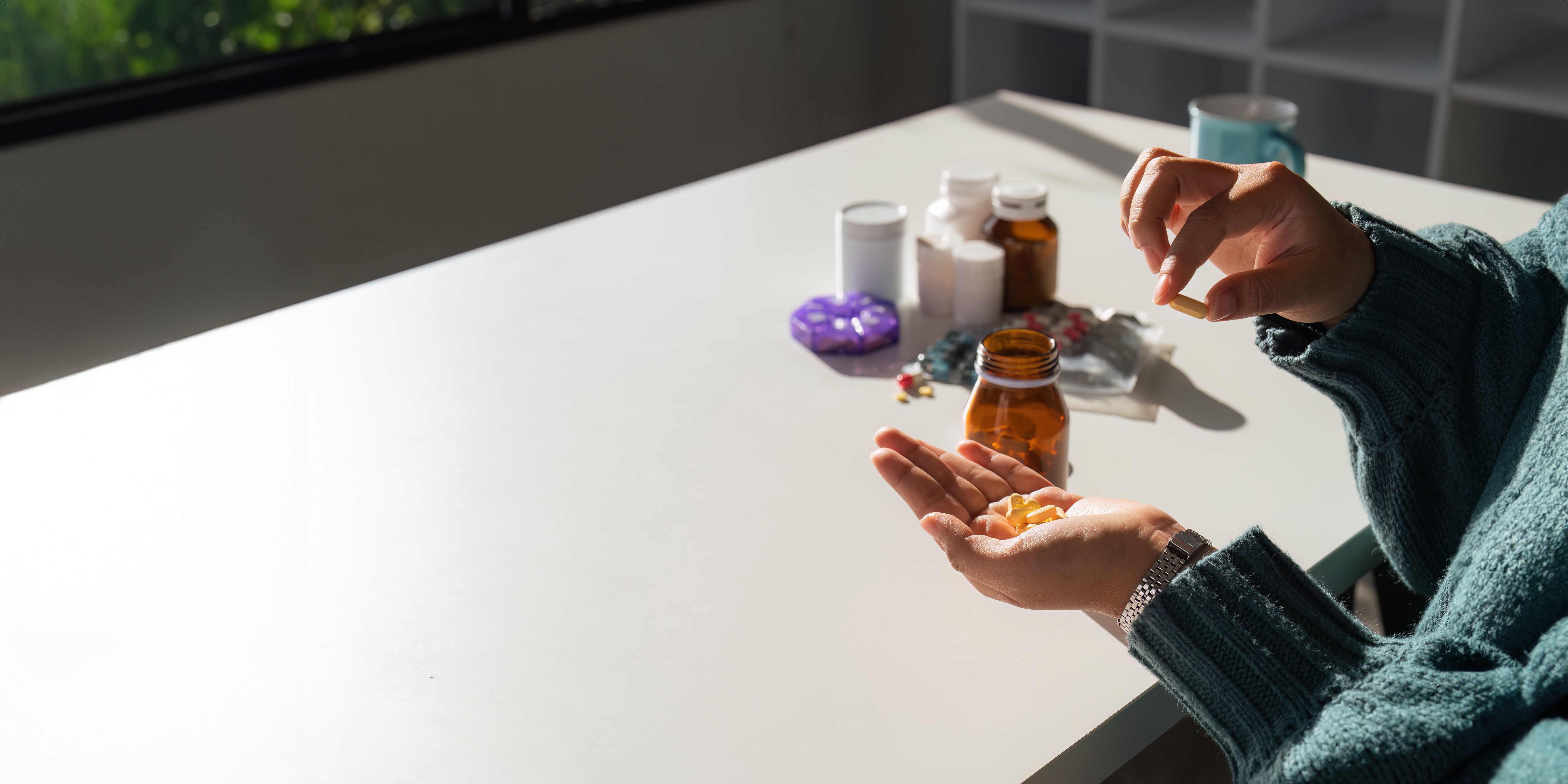 close-up-woman-holding-pill-in-hand-with-water-fee-2026-01-07-00-22-05-utc (1).jpg