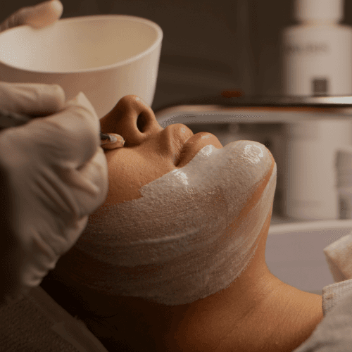 A woman getting a facial at a spa