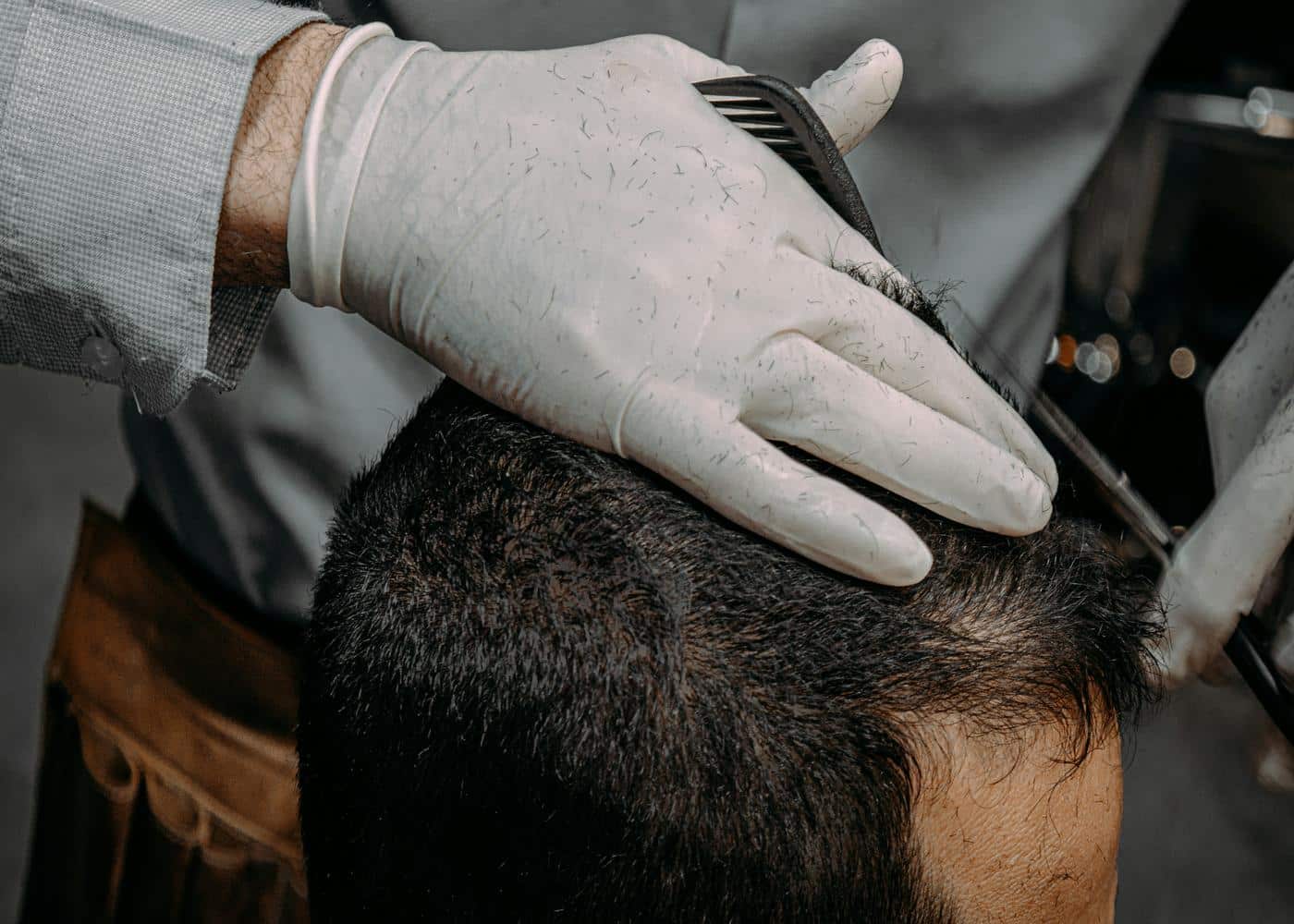 Hair growth hats - Man getting his hair cut