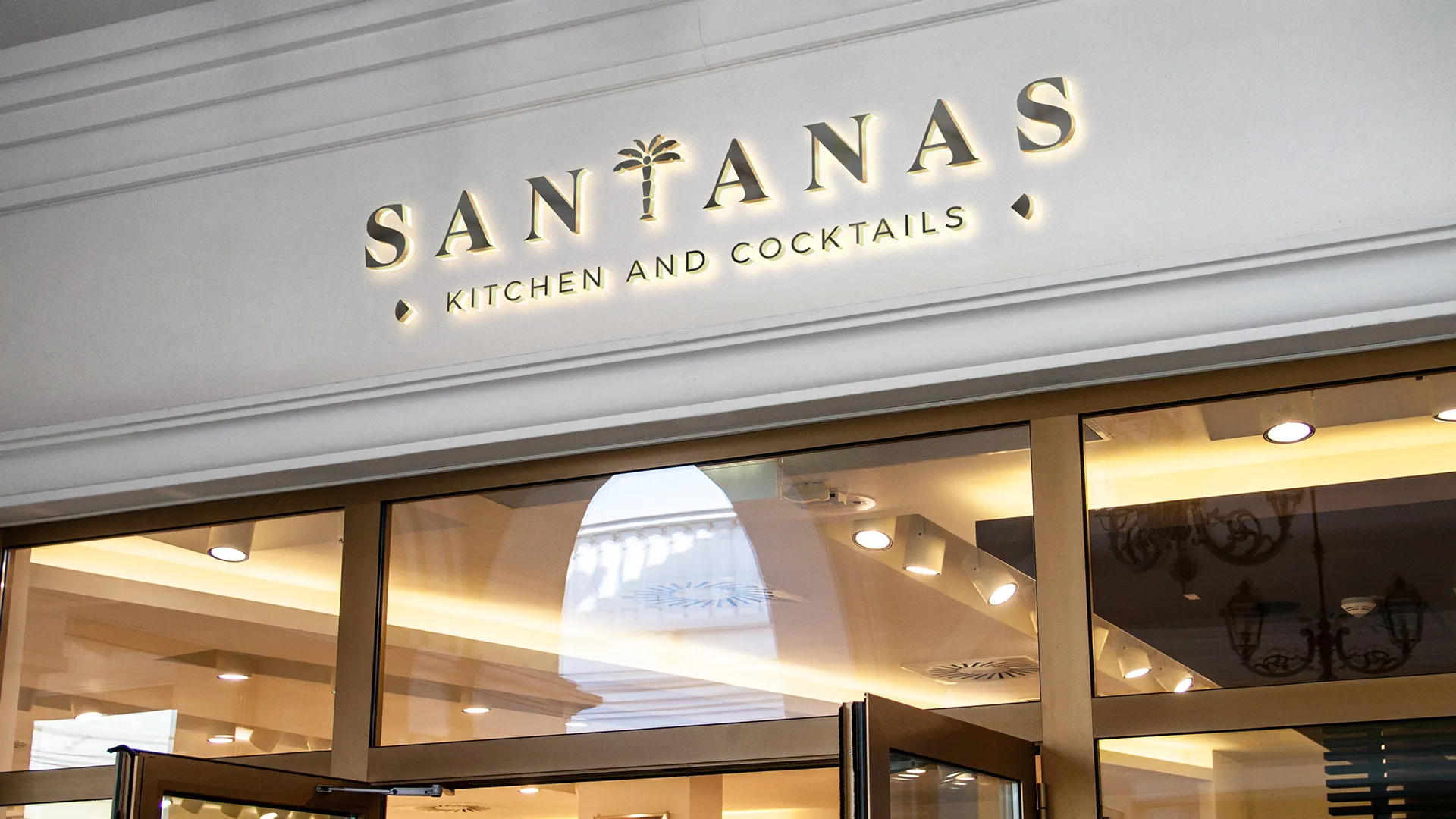 Santanas Kitchen and Cocktails storefront signage showcasing elegant hospitality brand identity