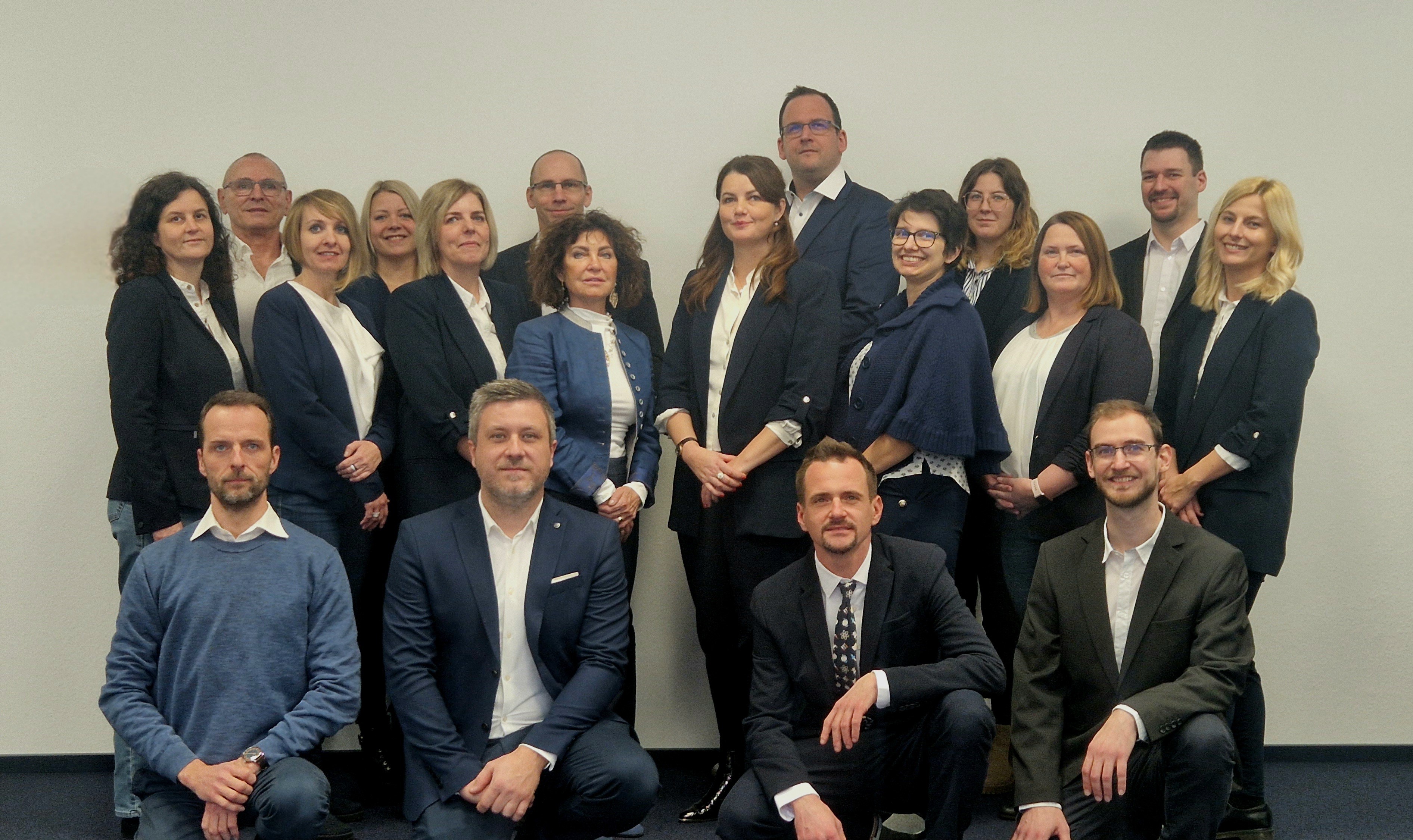 Team photo of the Bio-Science Ltd. Mena nd women in darker suits smiling