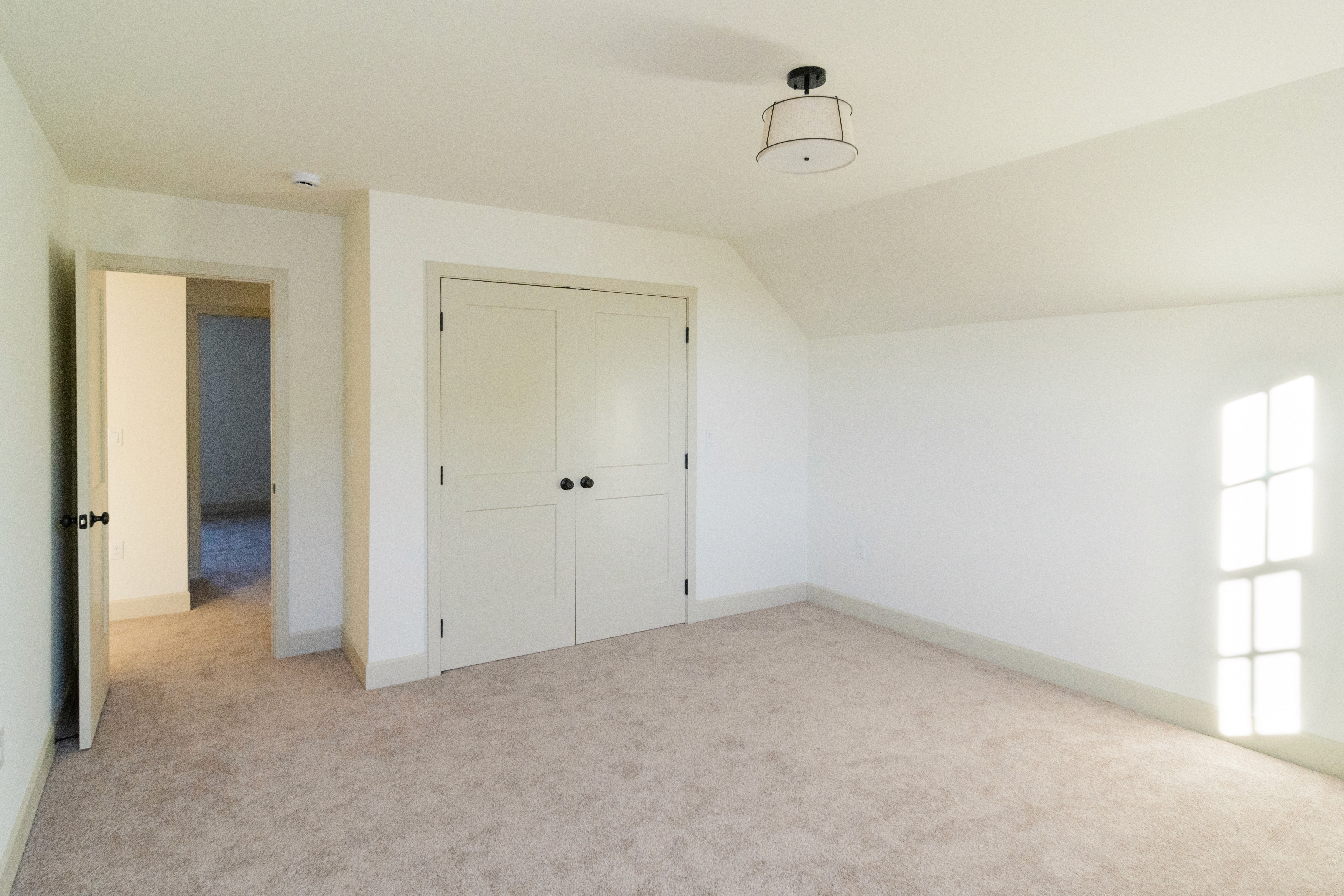 View of two door closet in the fourth bedroom.