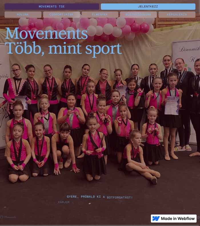 Group of girls in gymnastics attire with medals.