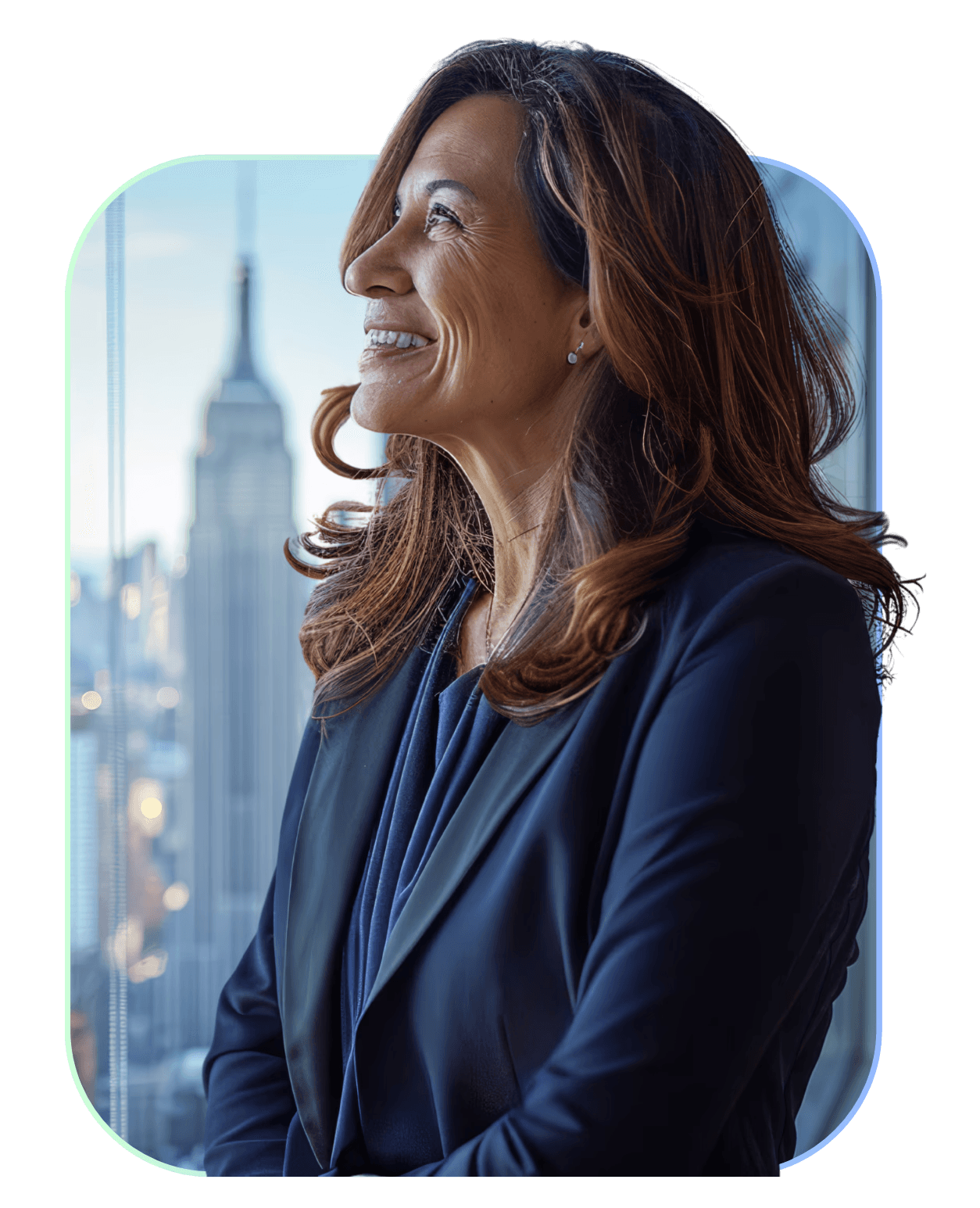 Smiling woman in business attire looking out a window at a city.