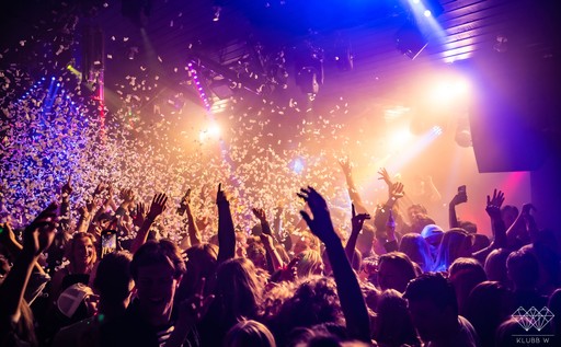 Woman holding a blue handheld mirror against a solid orange background