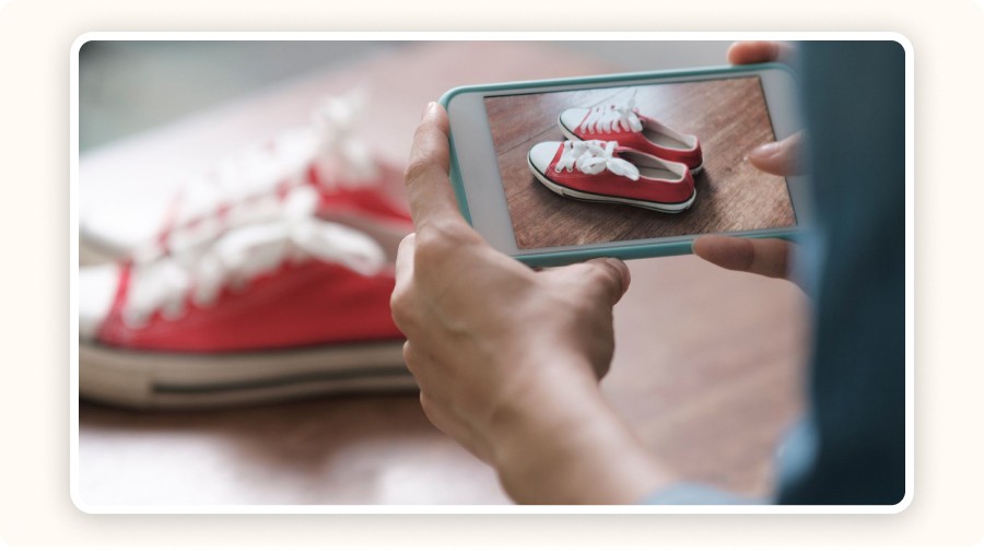 Person photographing shoes