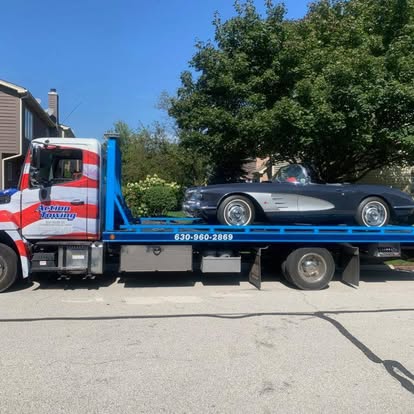 a laptop computer sitting on top of a wooden desk
