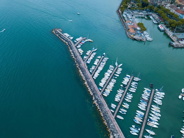 Marina with boats docked ready for refuelling and using payment terminal