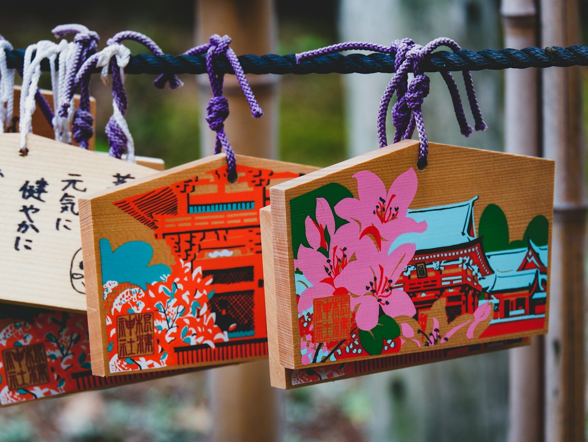 Wooden ema prayer plaques hanging at a Kyoto shrine