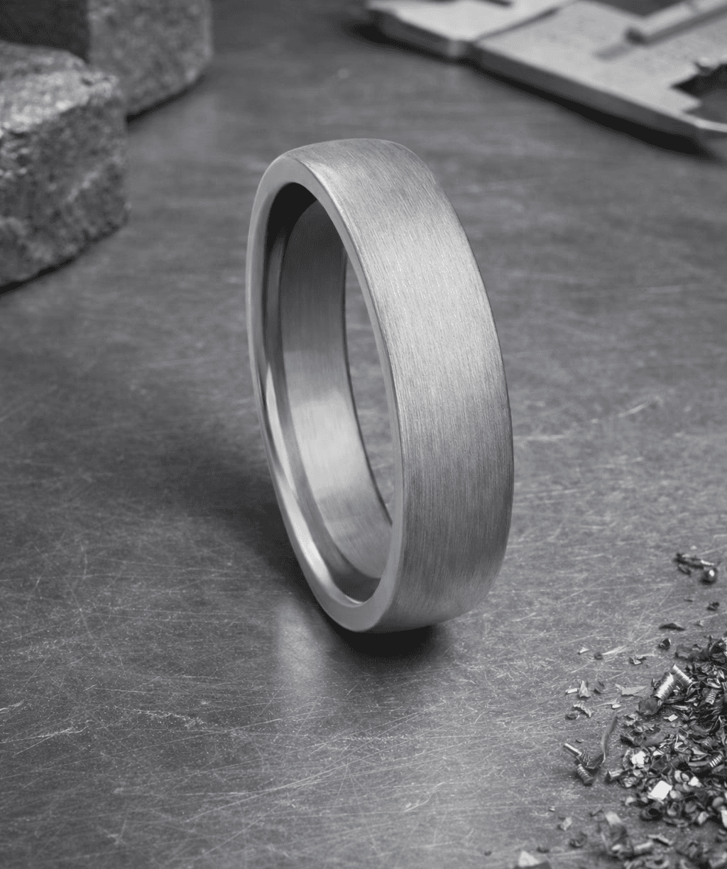 A ring reflects an eye.