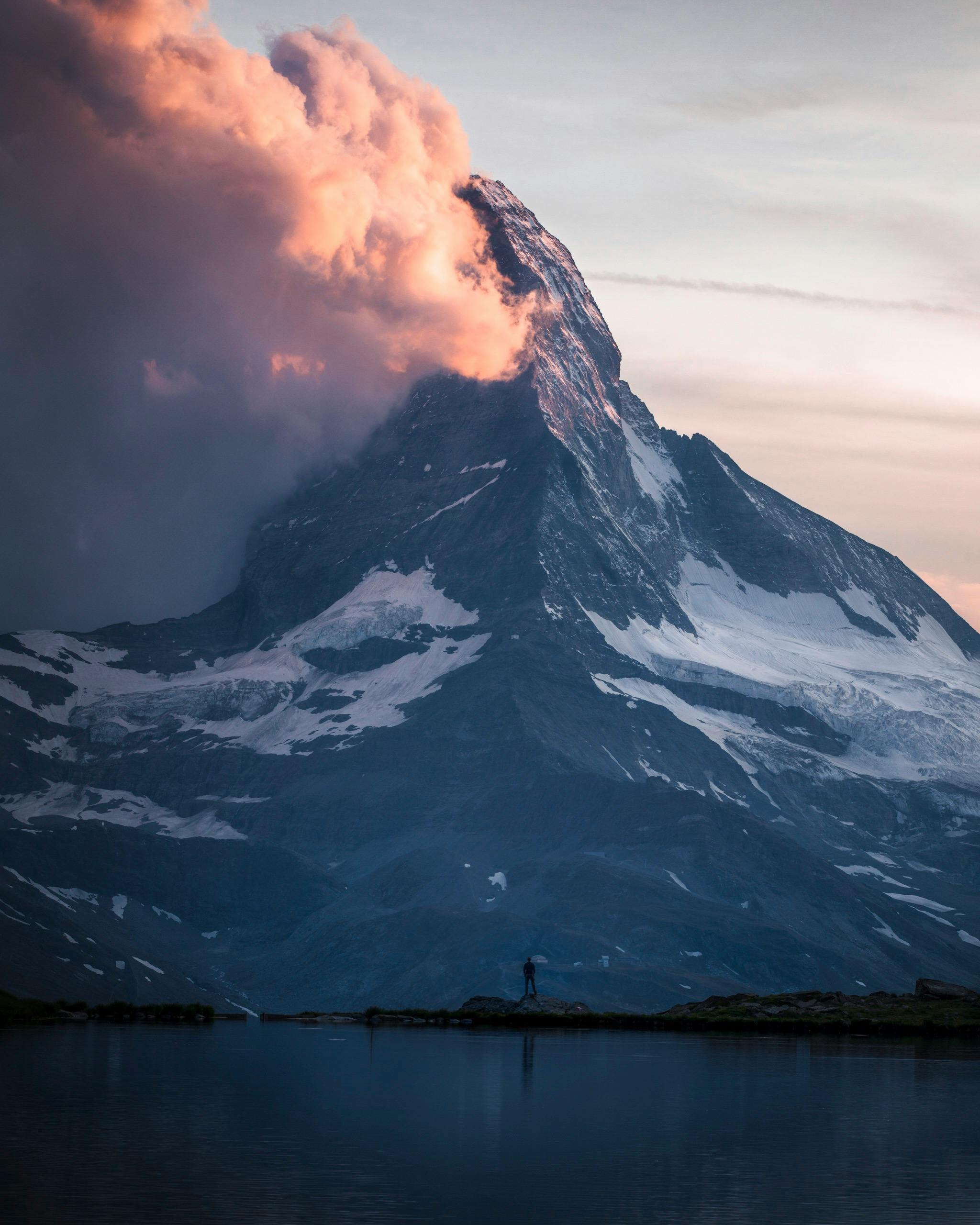 View of a mountain with clouds in the evening