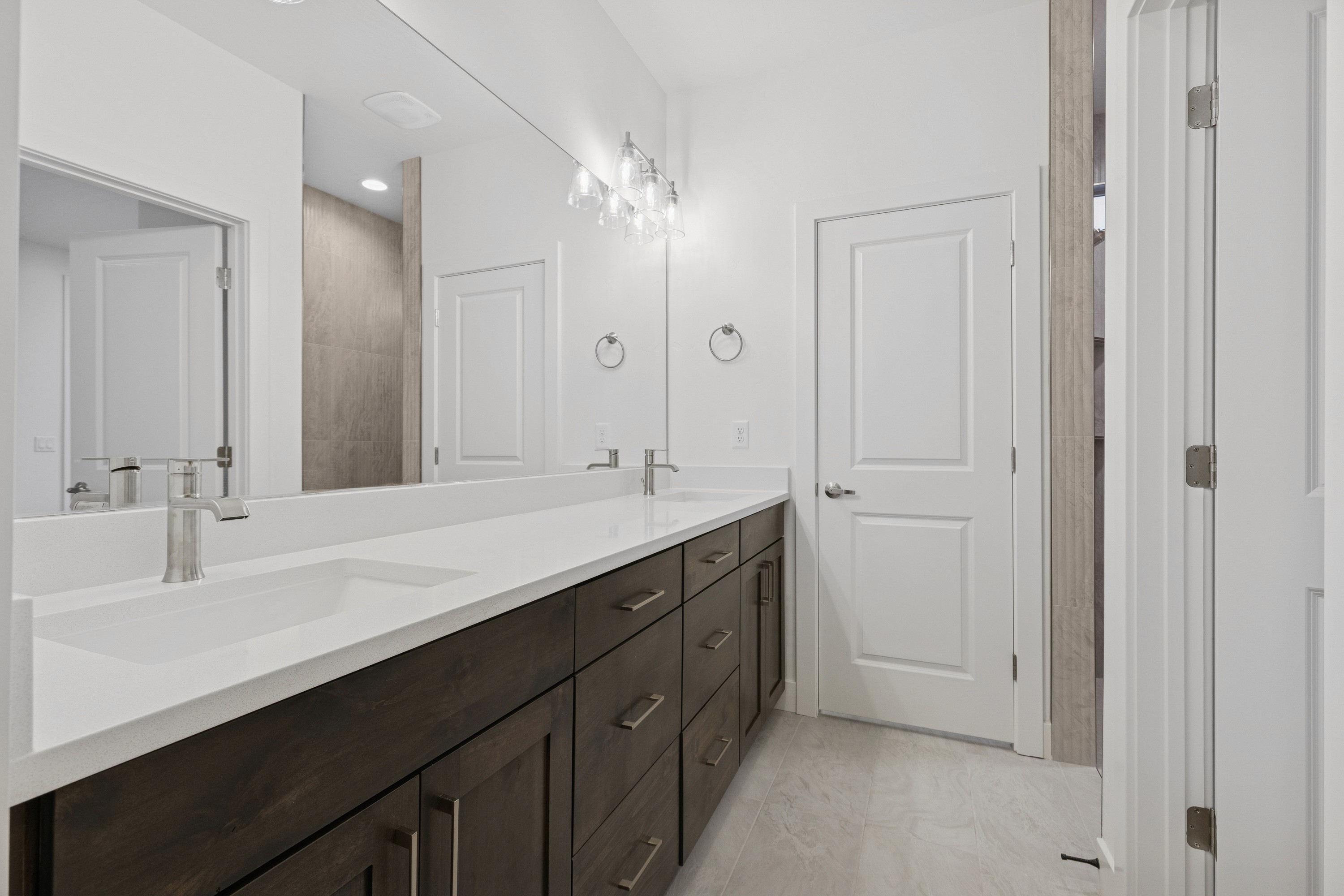 Primary suite retreat in The High Desert Home featuring natural light and neutral design in Hurricane Utah.