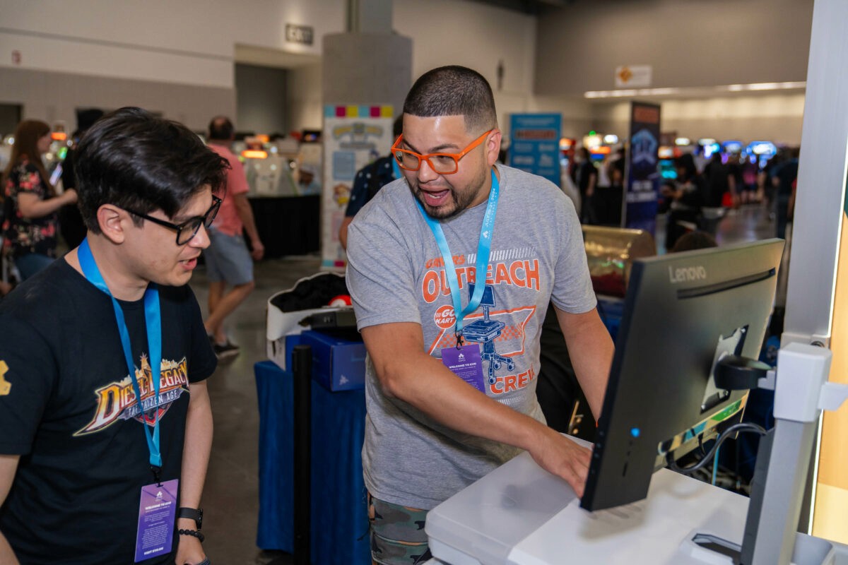 Gamers Outreach Marketing Director, Edwin Nolasco, showcases a GO Kart 3.0 unit to an Evo 2024 attendee.