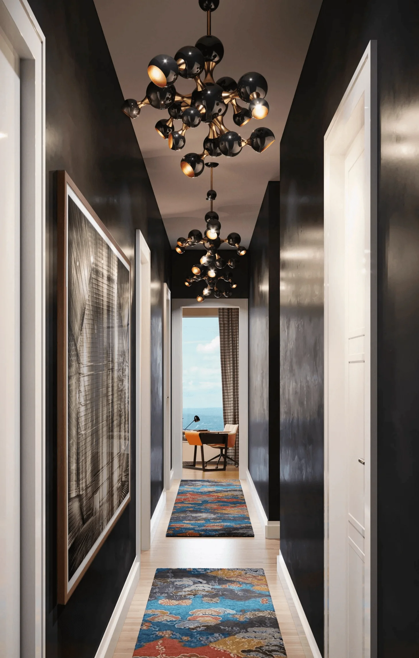 Black Venetian plaster lines this long hallway, punctuated by a vibrant rug and chandelier