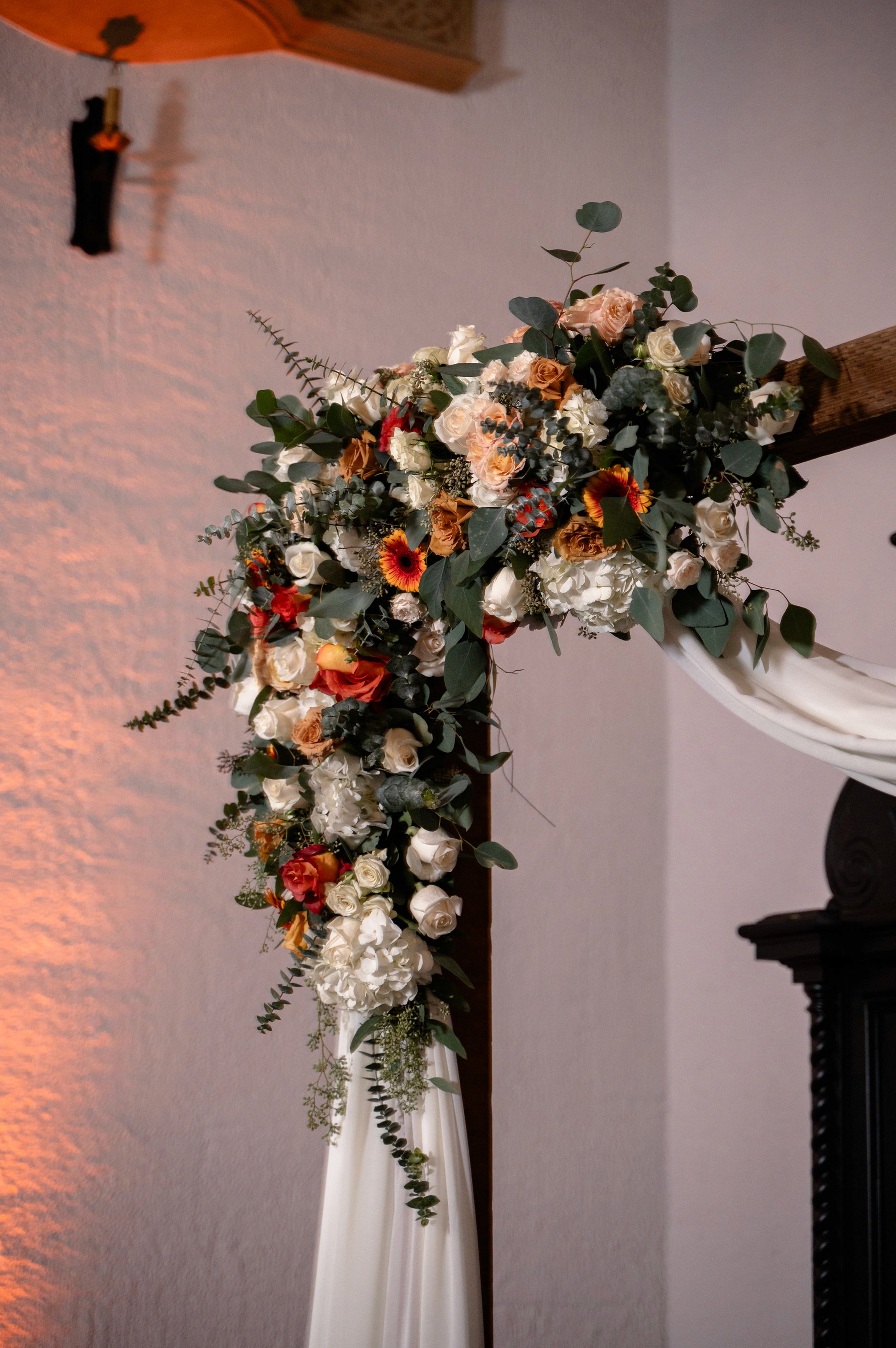Flat lay wedding details with bouquet, rings, and sparkling bridal heels
