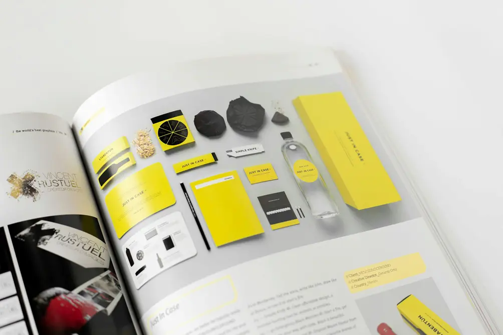 Open magazine showing a brand style guide and yellow packaging mockups.