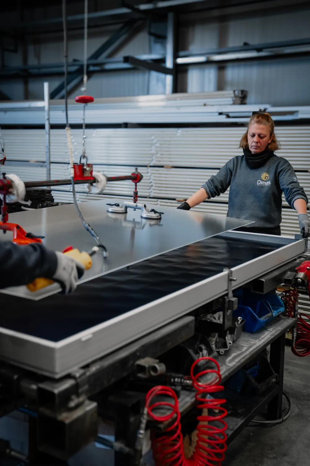 Dimas Solar worker assembling a solar collector