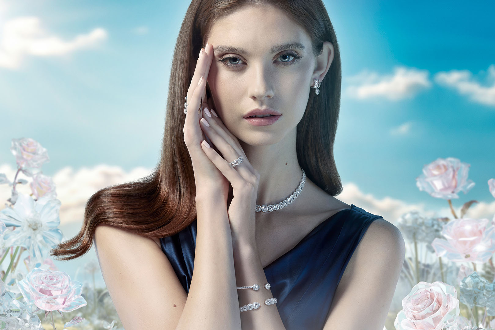 A female model wearing David Morris jewlery, with a fantasty background