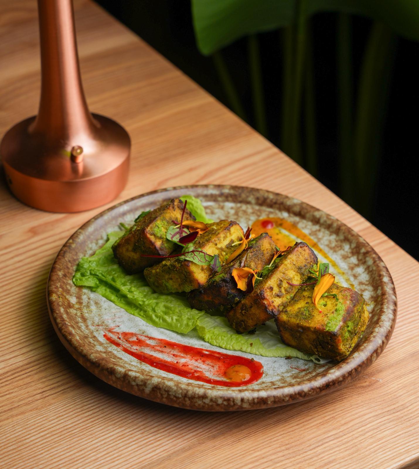 Tandoori paneer at Dhoom Greektown Toronto, grilled cottage cheese marinated in aromatic Indian spices