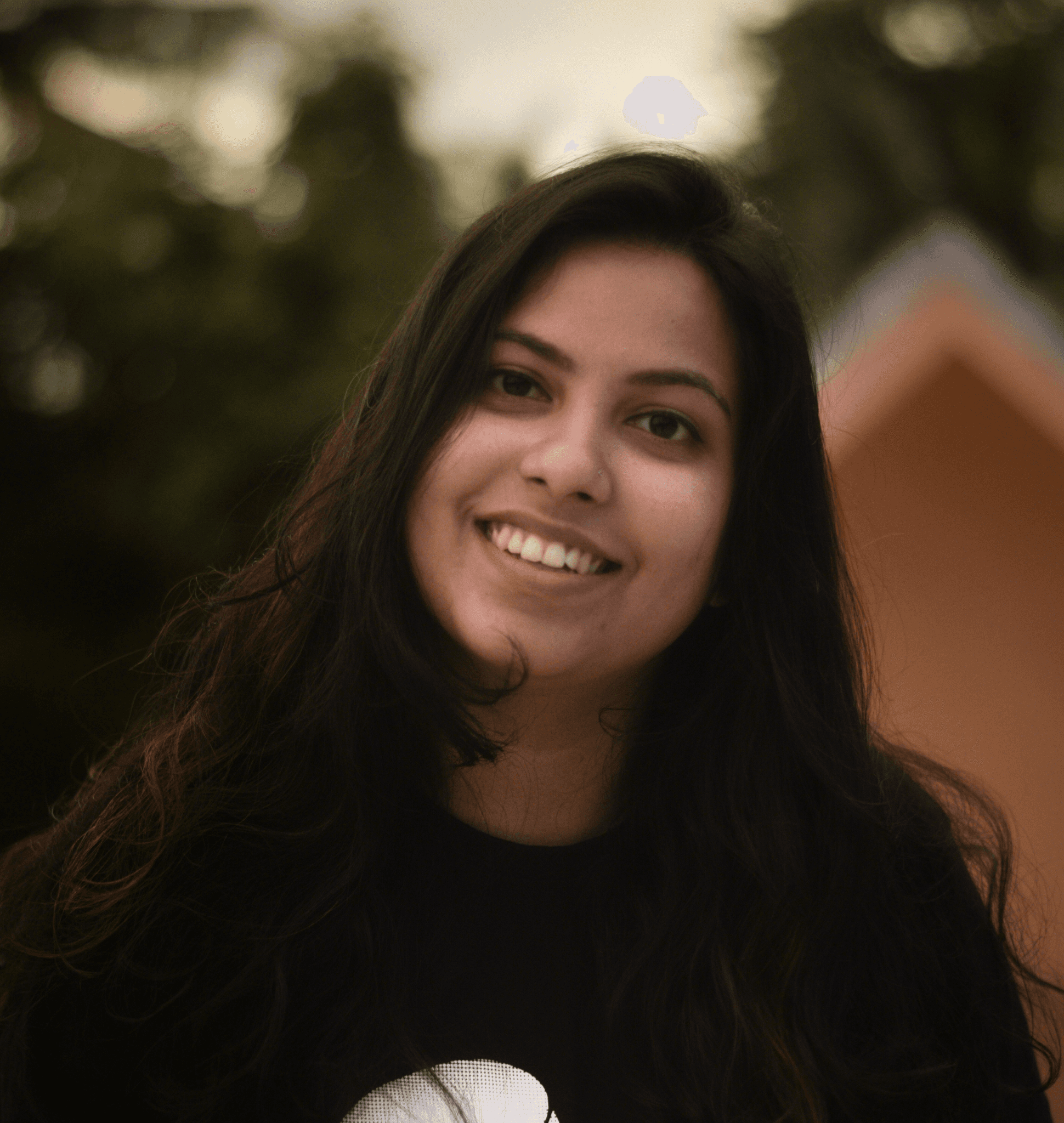 a woman with long dark hair wearing a t - shirt with a dog on it