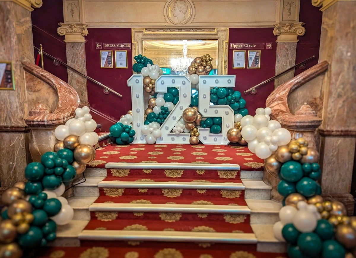 Illuminated numbers and letters with balloons for a corporate event